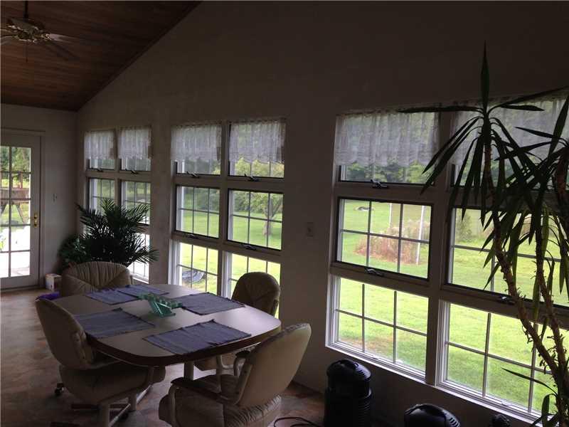 4378 Seneca Road Sharpsville, PA 16150 - Photo 7 of 24 Sunroom. 30x10 windowed sunroom