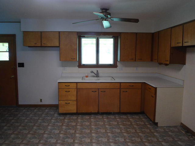 503 Cleveland Avenue Rochelle, IL 61068 - Photo 4 of 13 a kitchen with sink and cabinets