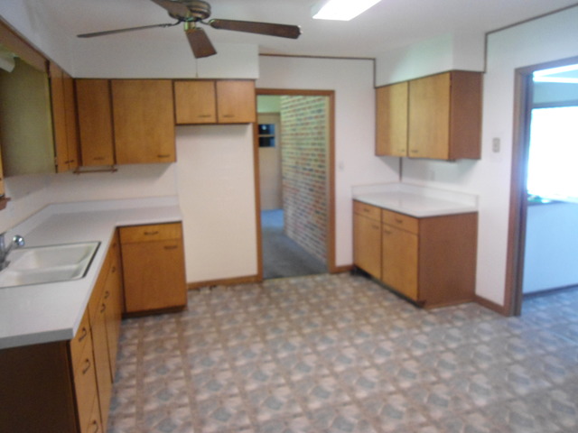 503 Cleveland Avenue Rochelle, IL 61068 - Photo 5 of 13 a view of kitchen with cabinets and wooden floor