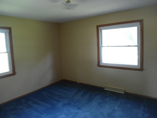 503 Cleveland Avenue Rochelle, IL 61068 - Photo 8 of 13 an empty room with a window