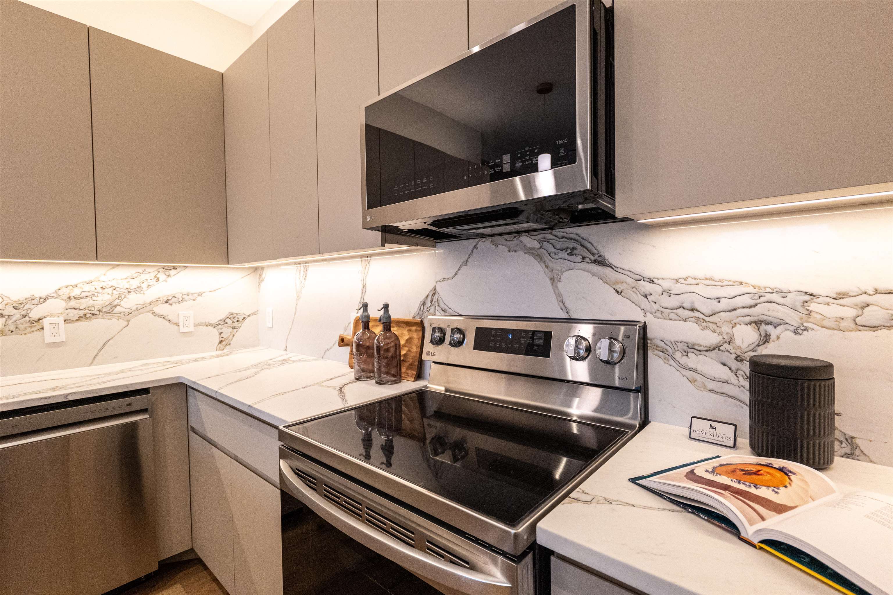 1722 Springfield Avenue, Unit 404 Maplewood, NJ 07040 - Photo 6 of 30 a kitchen with a stove and a microwave