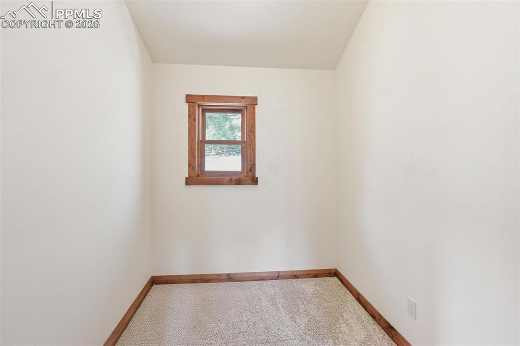 89 Ranch View Road Florissant, CO 80816 - Photo 26 of 50 Primary bedroom hosts an office space. This room could also serve as a reading a library, hobby corner, or dressing room.
