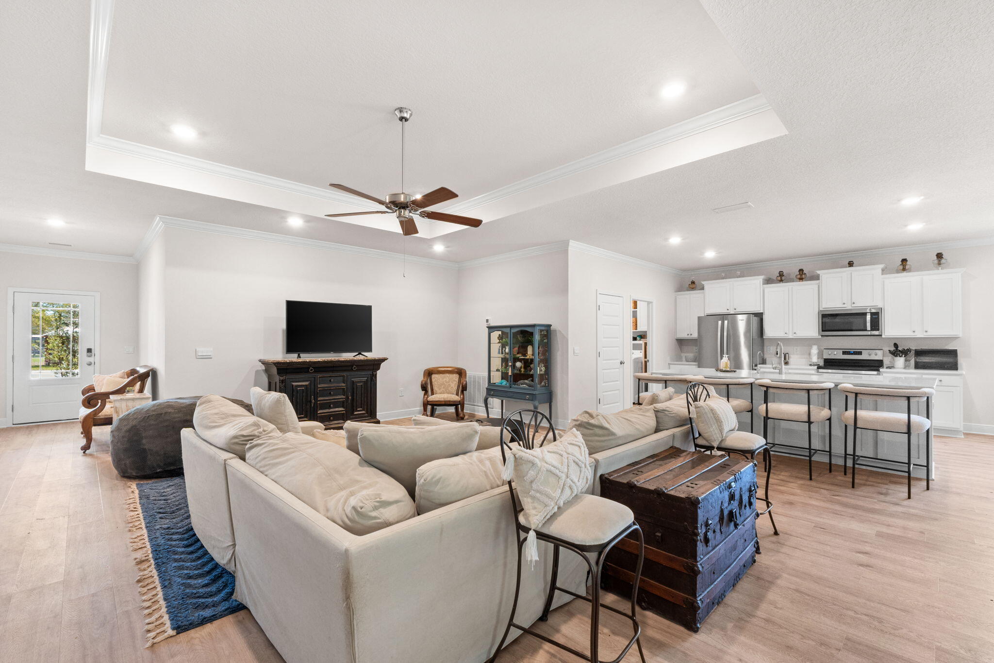 44 Secluded Circle Freeport, FL 32439 - Photo 13 of 43 a living room with furniture a flat screen tv and kitchen view