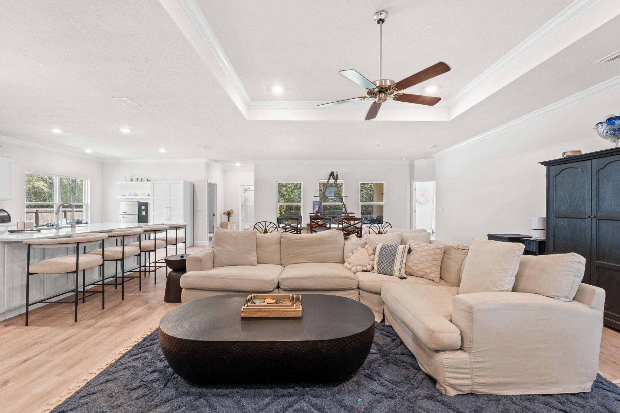 44 Secluded Circle Freeport, FL 32439 - Photo 15 of 43 a living room with furniture kitchen view and a chandelier
