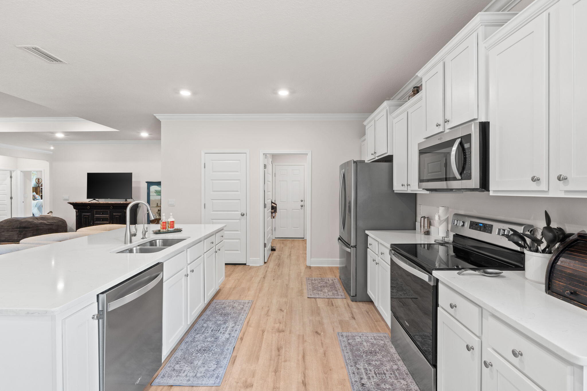 44 Secluded Circle Freeport, FL 32439 - Photo 20 of 43 a kitchen with stainless steel appliances a sink stove and refrigerator