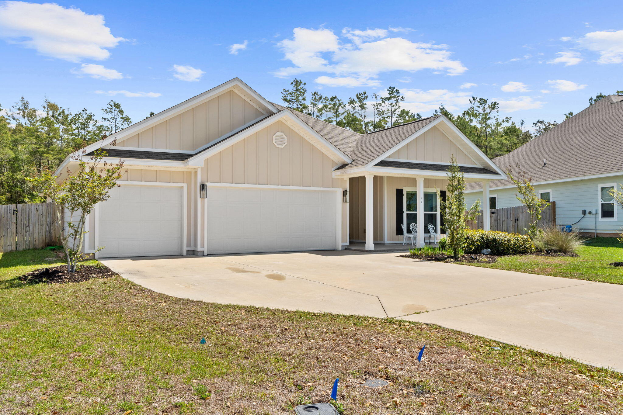 44 Secluded Circle Freeport, FL 32439 - Photo 2 of 43 a front view of a house with a yard and garage