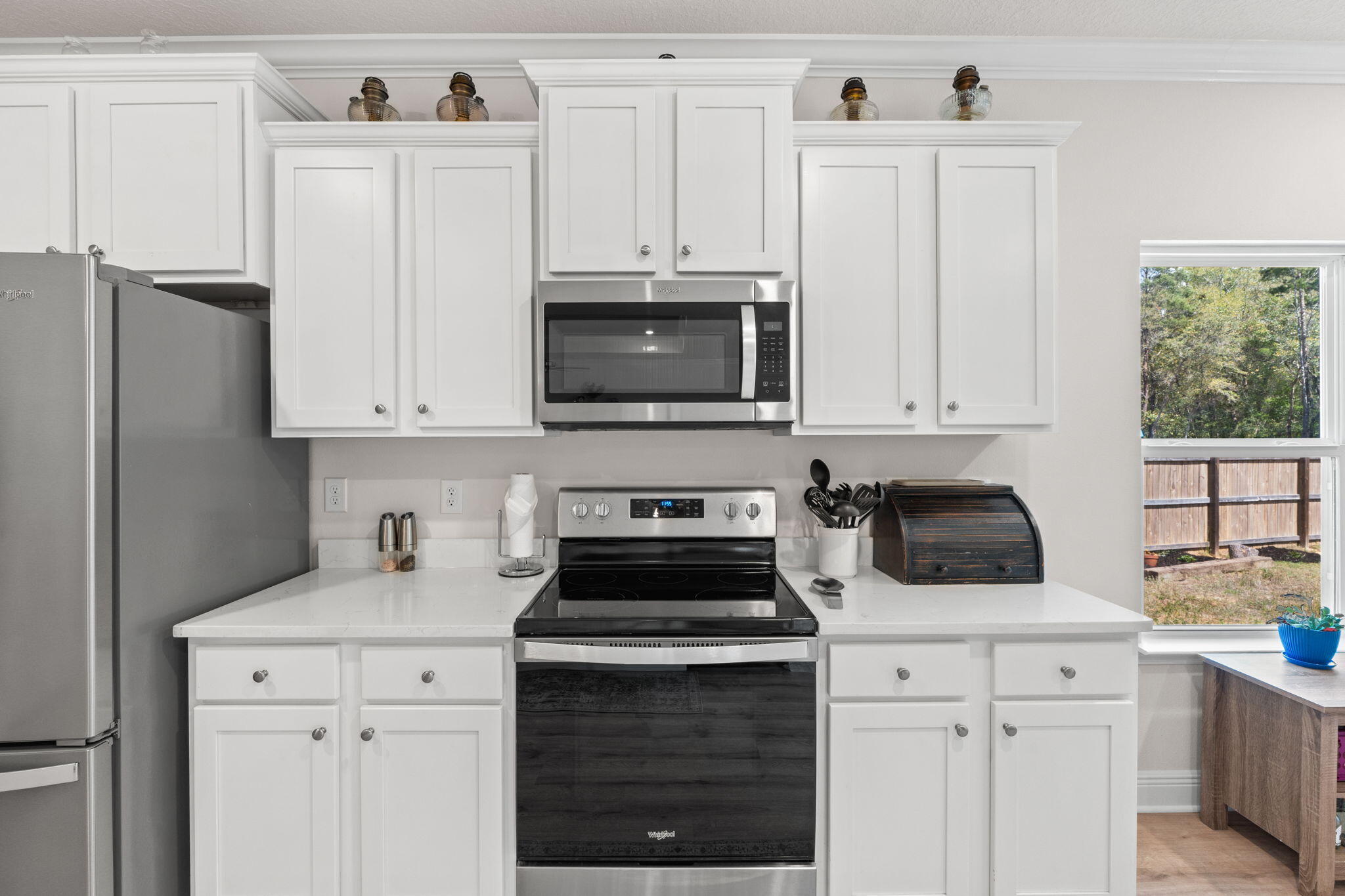 44 Secluded Circle Freeport, FL 32439 - Photo 21 of 43 a kitchen with cabinets appliances a sink and a window
