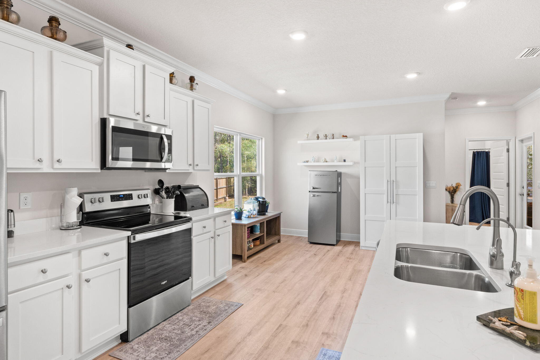 44 Secluded Circle Freeport, FL 32439 - Photo 23 of 43 a kitchen with stainless steel appliances granite countertop a refrigerator stove microwave and sink