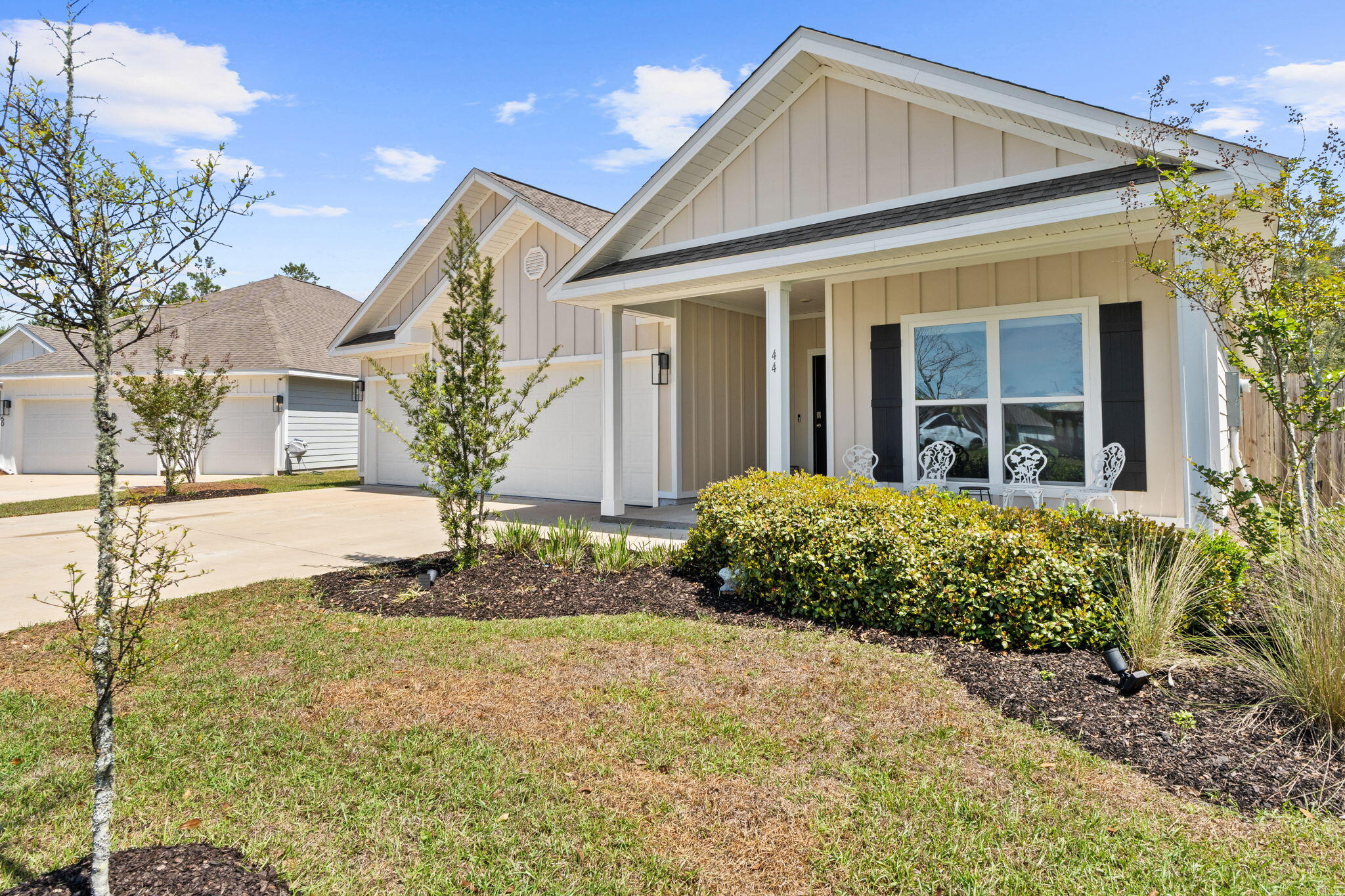 44 Secluded Circle Freeport, FL 32439 - Photo 3 of 43 a front view of a house with garden