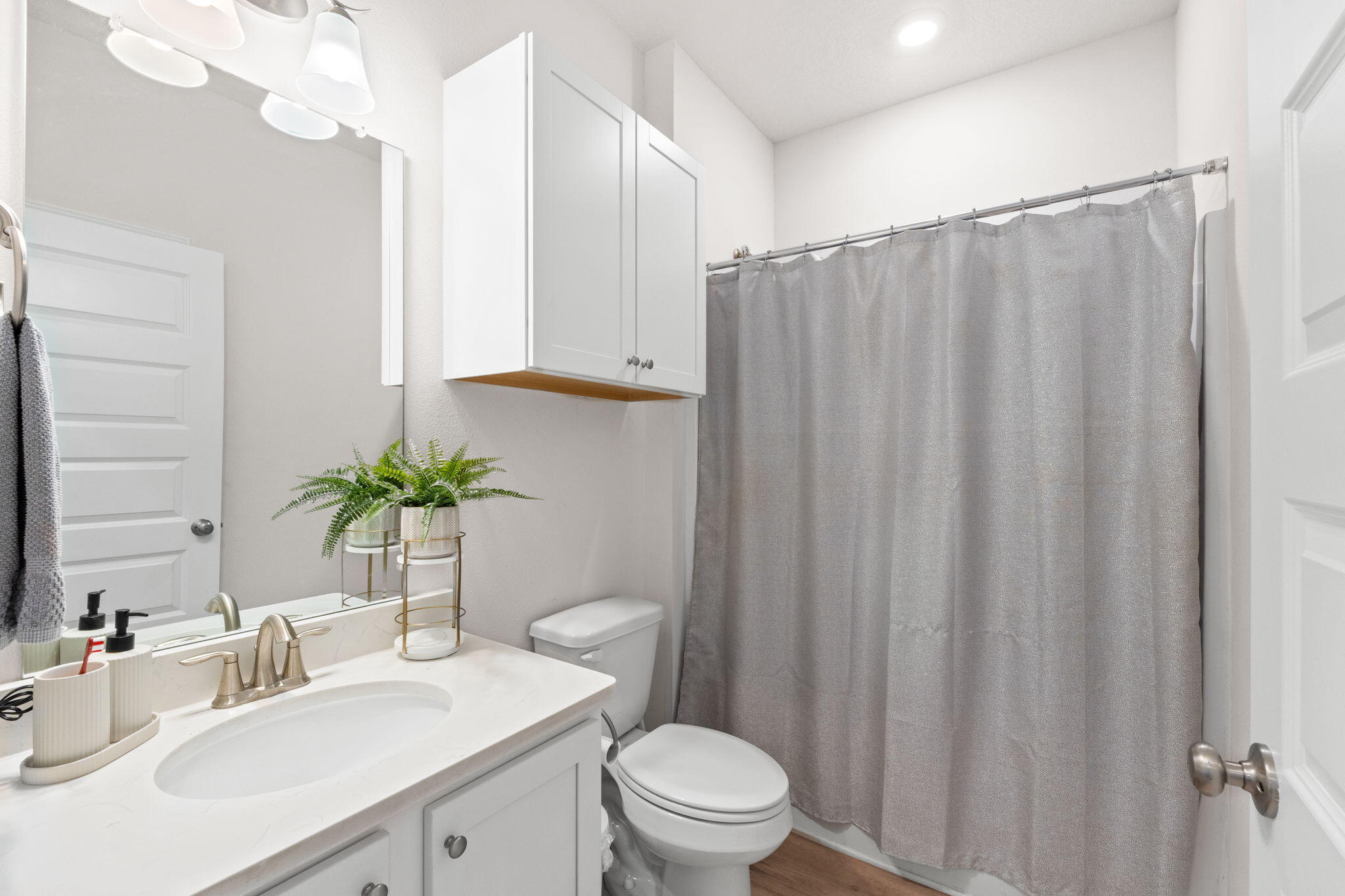 44 Secluded Circle Freeport, FL 32439 - Photo 8 of 43 a bathroom with a sink a toilet a mirror and vanity