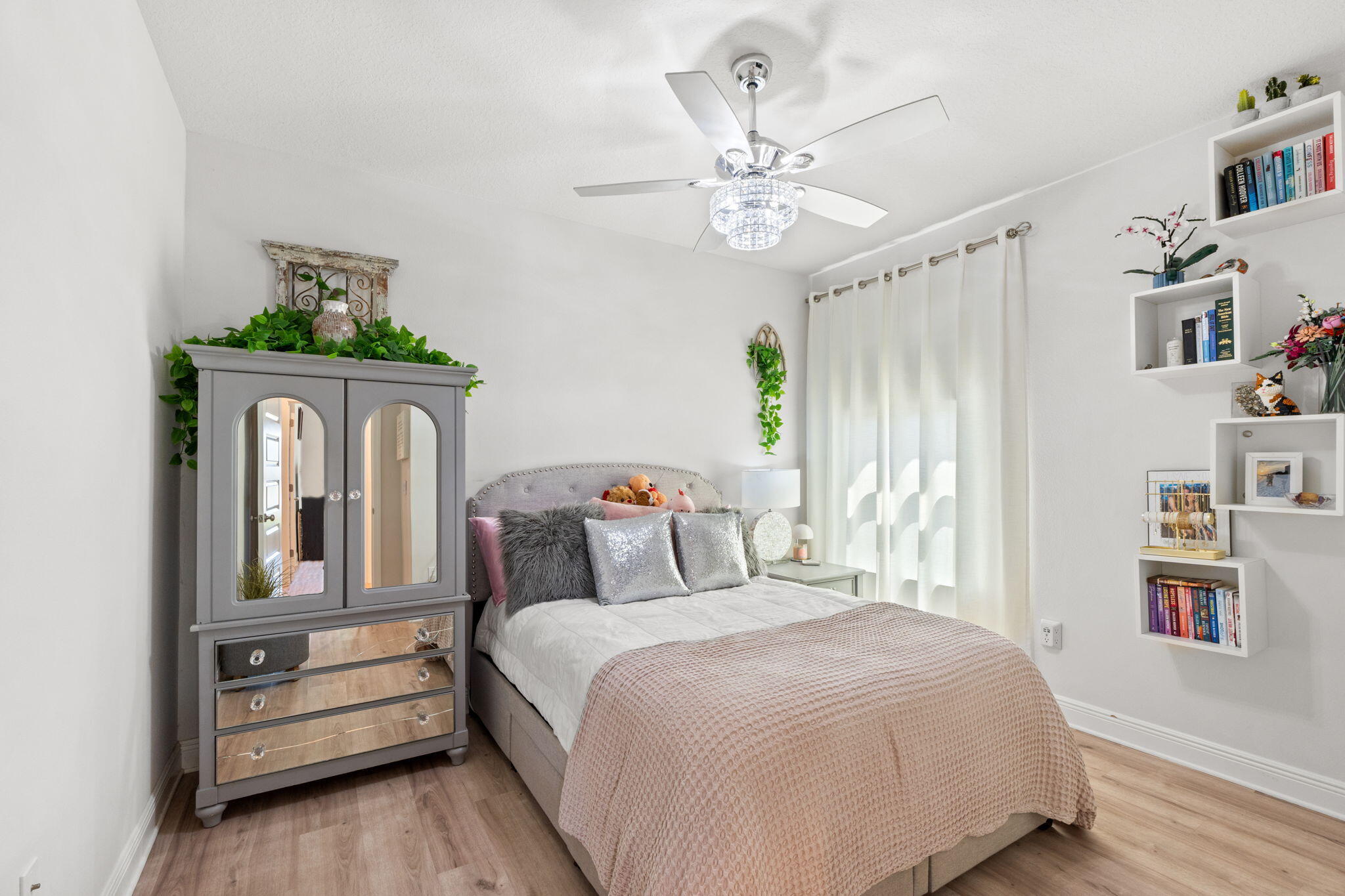 44 Secluded Circle Freeport, FL 32439 - Photo 10 of 43 a bedroom with a bed and a chandelier