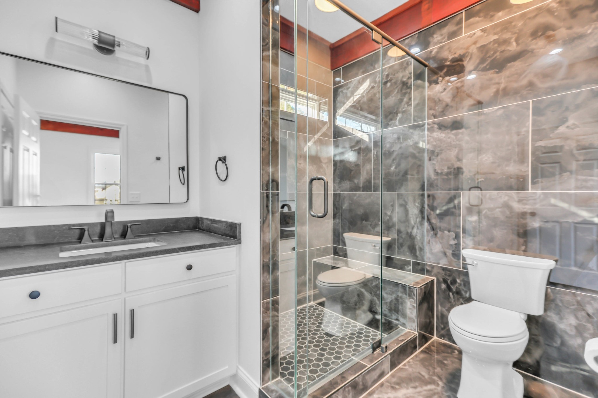 1399 Saundersville Road Hendersonville, TN 37075 - Photo 20 of 56 a bathroom with a granite countertop sink a toilet and a mirror