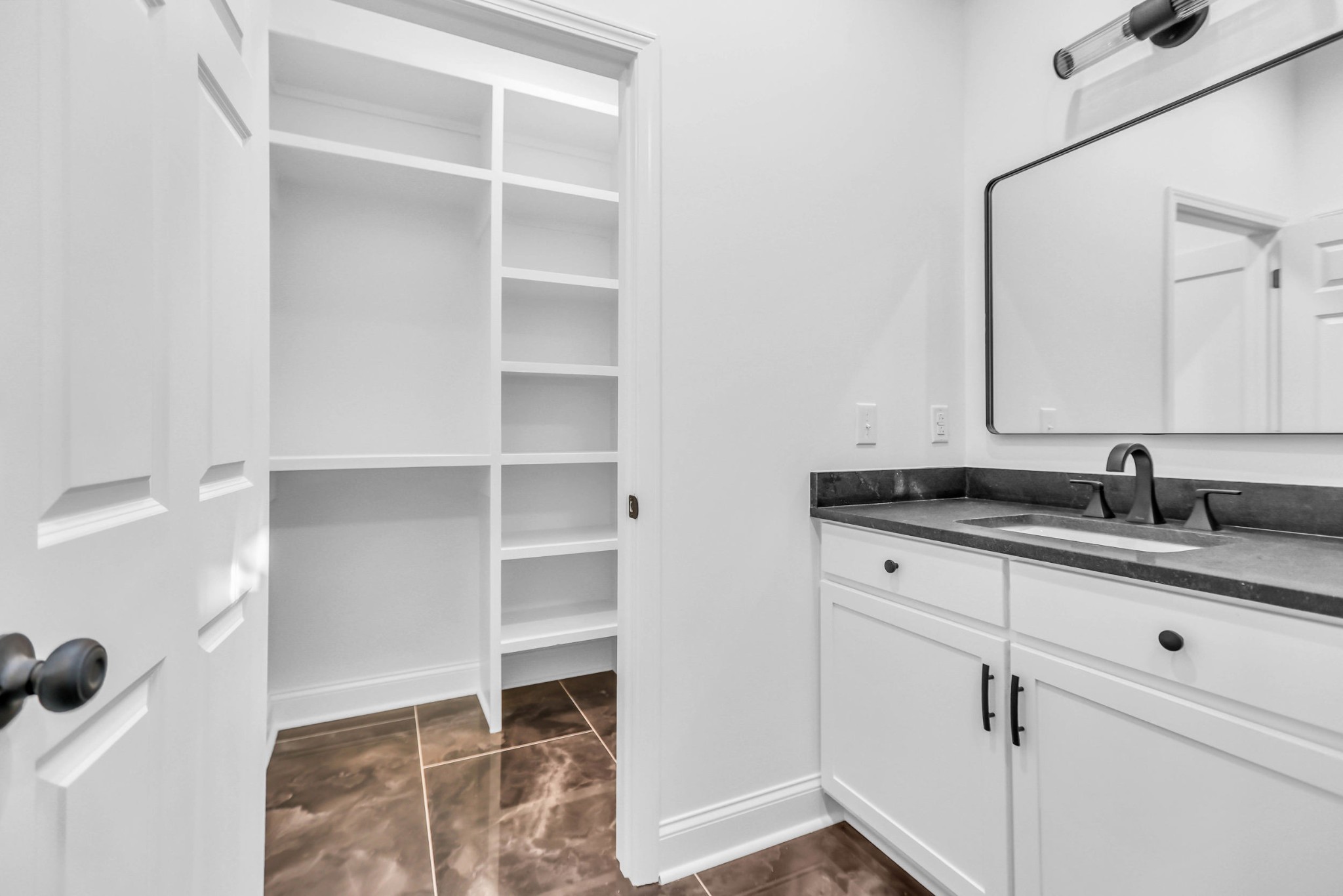 1399 Saundersville Road Hendersonville, TN 37075 - Photo 22 of 56 a bathroom with a sink and a mirror