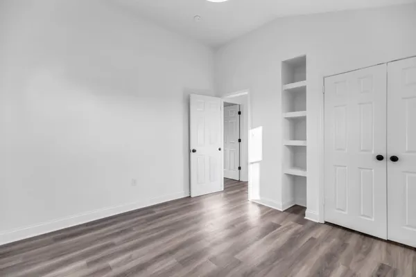 a bathroom with a sink vanity mirror and toilet