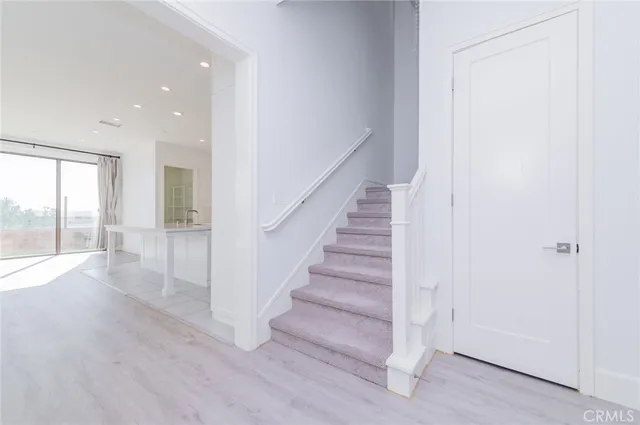 a view of entryway with wooden floor