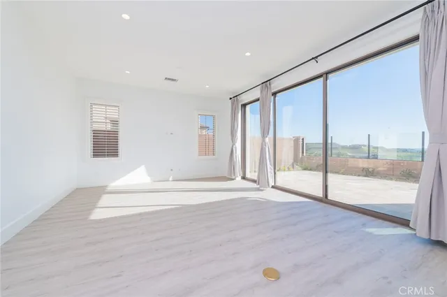 a view of an empty room and window