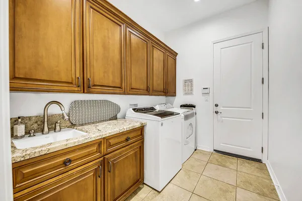 a view of a kitchen with sink and dishwasher