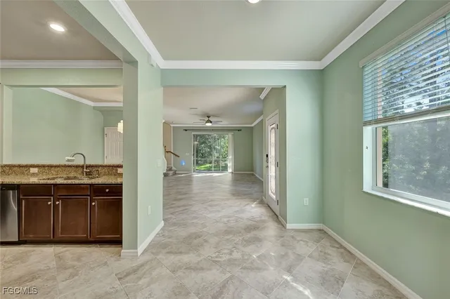a view of an empty room with a chandelier