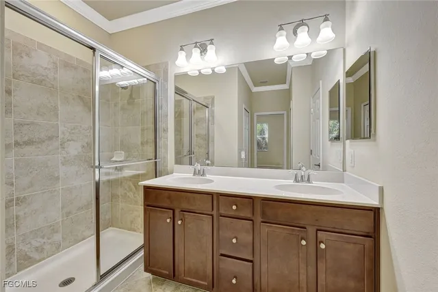 an empty room with windows and ceiling fan