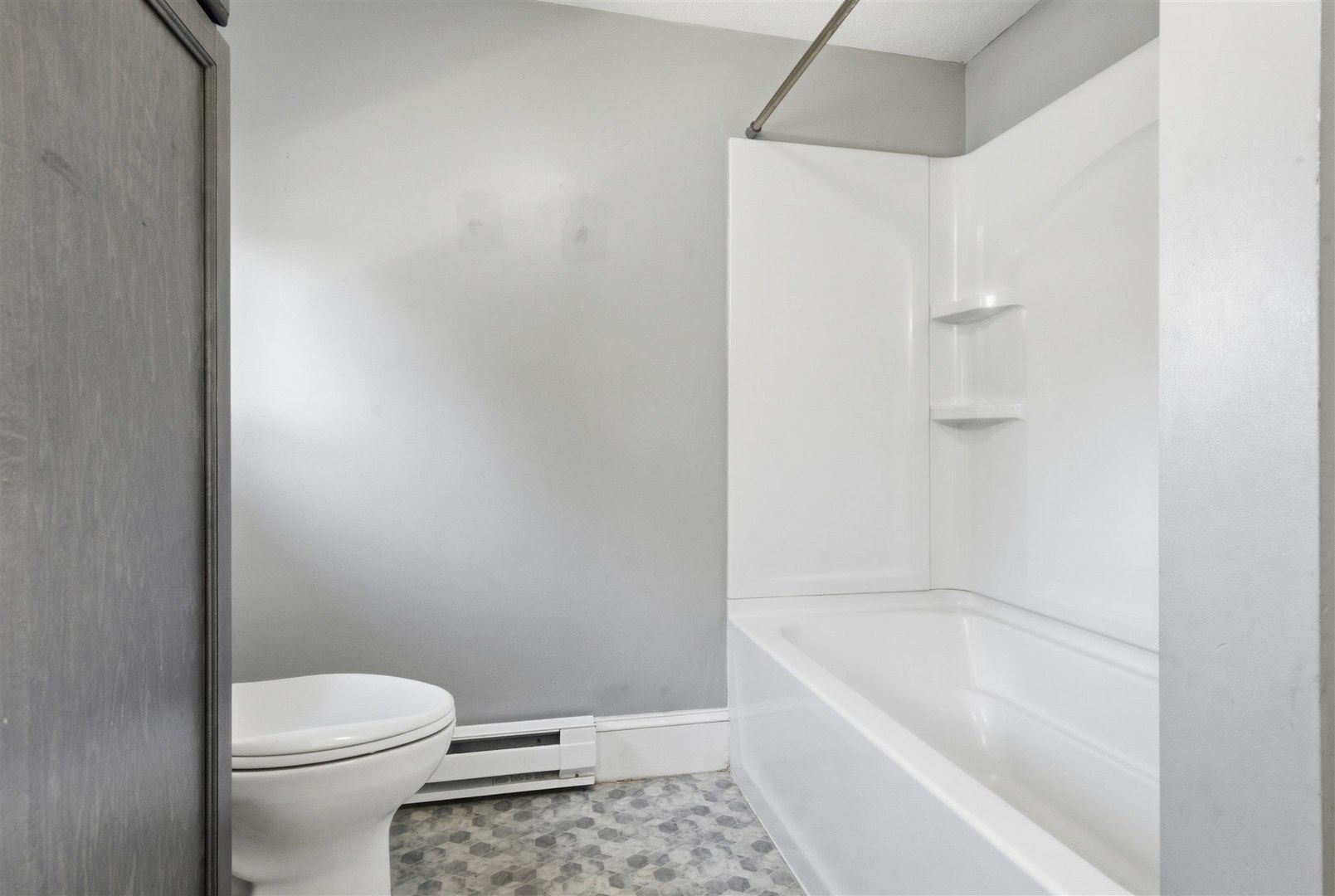 305 South Perry Street Carlock, IL 61725 - Photo 17 of 30 a bathroom with a bathtub and a toilet