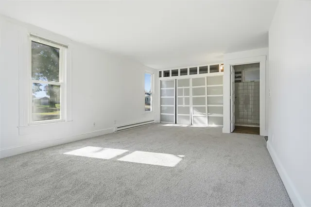 an empty room with windows