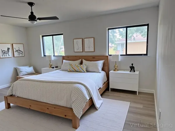 a bedroom with a bed and window