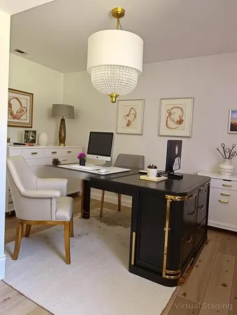 a view of a workspace with furniture