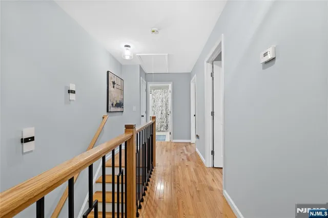 a bed room with a bed window and a potted plant
