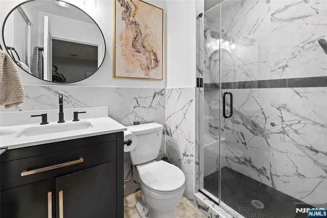 a view of a hallway with workspace and a mirror