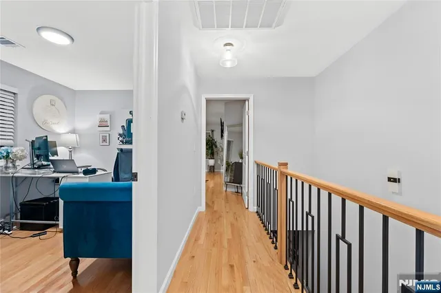 a work room with furniture and a potted plant