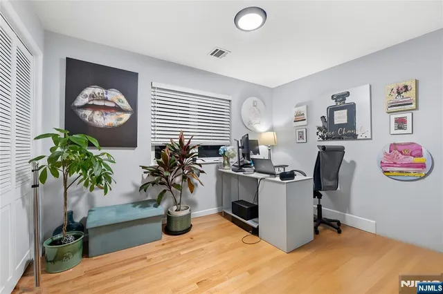 a bedroom with a bed and a chair