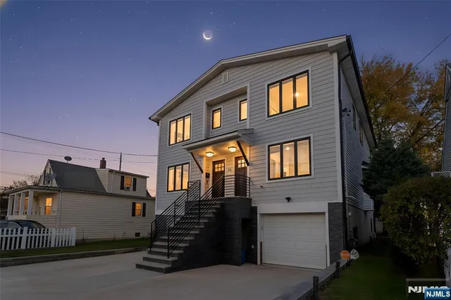 a front view of a house with a garage