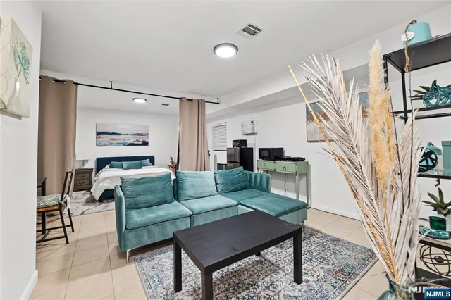 a bedroom with a bed a table and chair