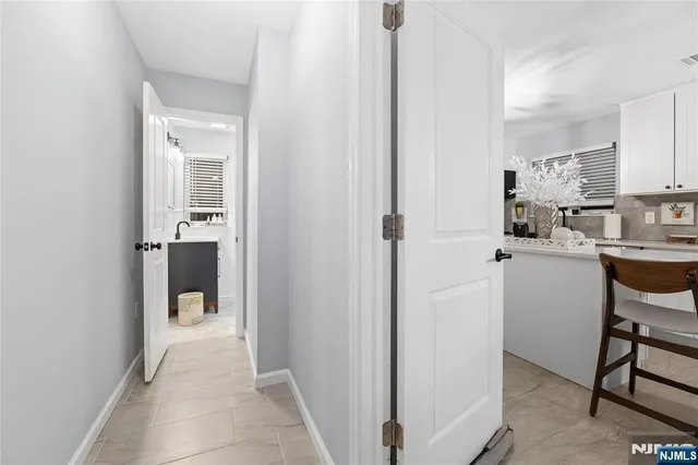a bathroom with a toilet a sink and a mirror