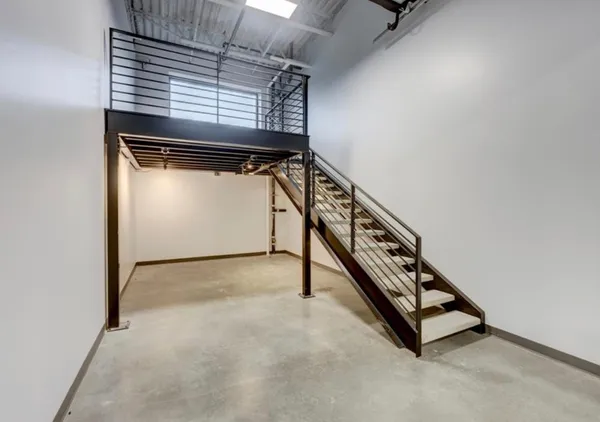 a view of an empty room with windows