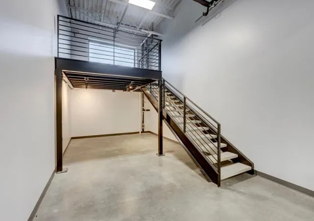 a view of an empty room with windows