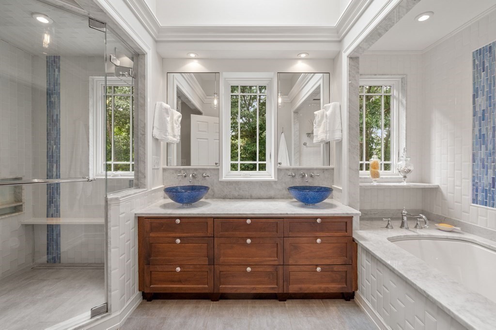 11 Equestrian Drive North Reading, MA 01864 - Photo 16 of 41 a bathroom with a granite countertop double vanity sink a mirror and a bathtub