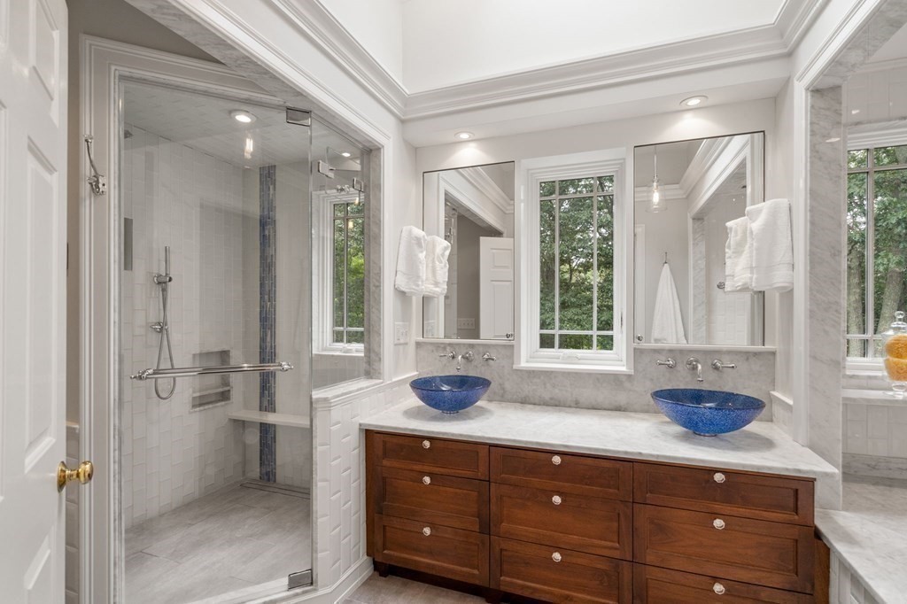 11 Equestrian Drive North Reading, MA 01864 - Photo 17 of 41 a bathroom with a sink a vanity and a large mirror