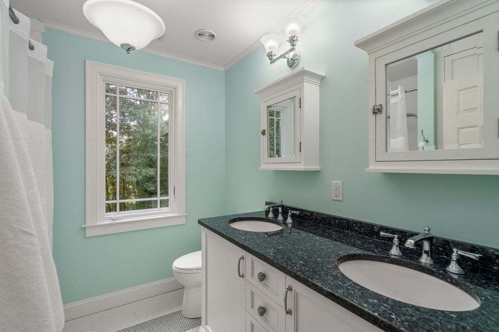 11 Equestrian Drive North Reading, MA 01864 - Photo 19 of 41 a bathroom with a granite countertop sink toilet and mirror