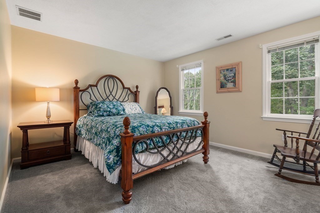 11 Equestrian Drive North Reading, MA 01864 - Photo 20 of 41 a bedroom with a bed and a window