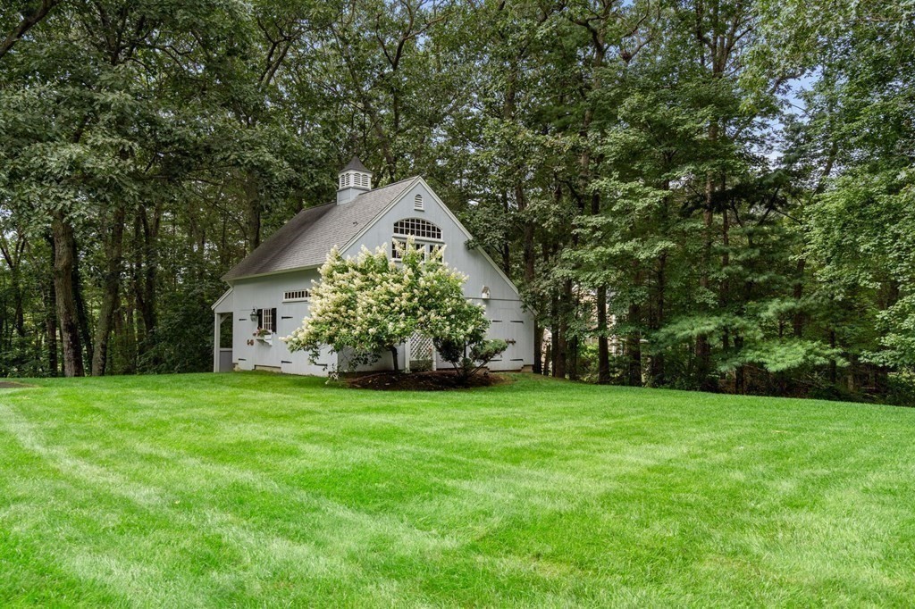 11 Equestrian Drive North Reading, MA 01864 - Photo 26 of 41 a front view of a house with a yard