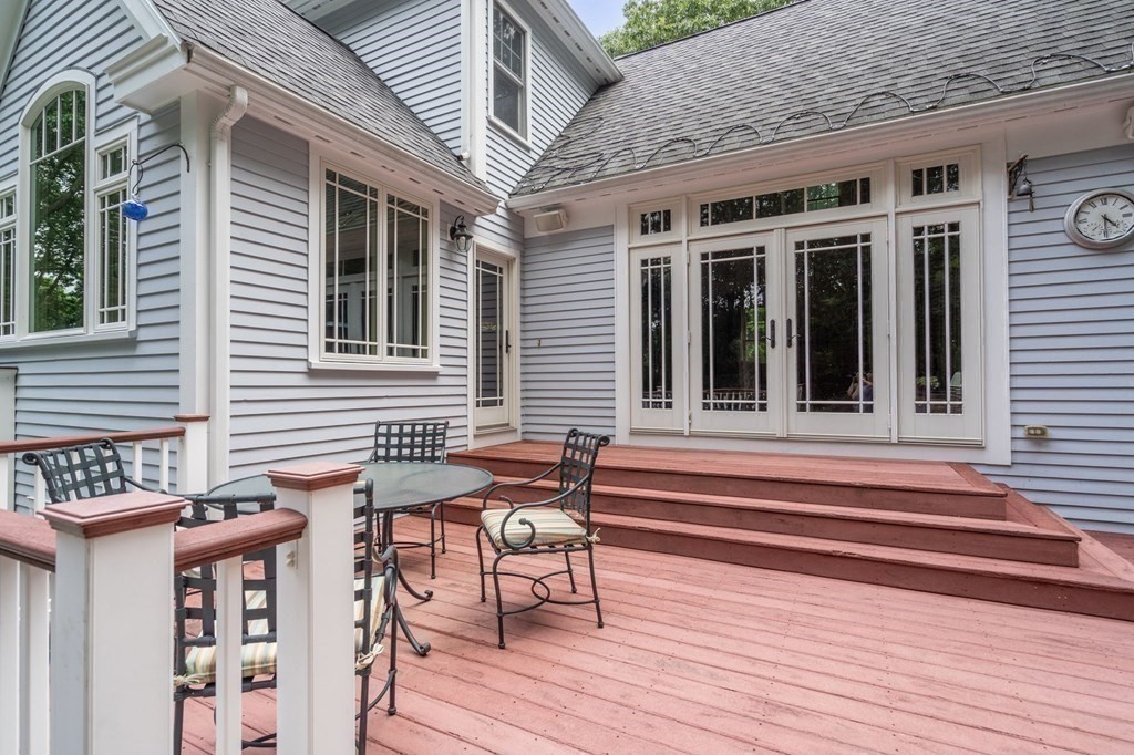 11 Equestrian Drive North Reading, MA 01864 - Photo 31 of 41 a view of a patio with table and chairs with wooden floor and fence