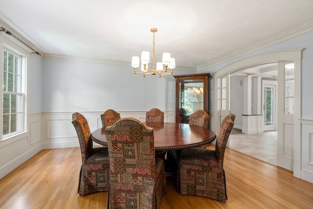 11 Equestrian Drive North Reading, MA 01864 - Photo 6 of 41 a dining room with furniture a chandelier and wooden floor