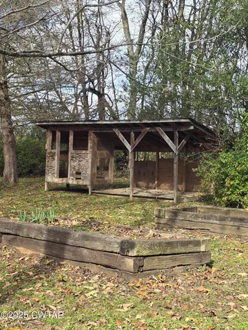 a backyard of house with yard and outdoor seating