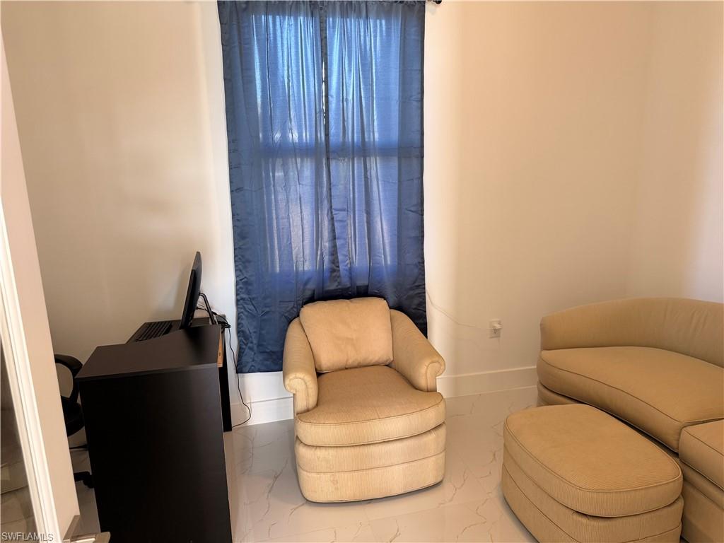 941 Columbus Boulevard Lehigh Acres, FL 33974 - Photo 9 of 41 a bathroom with a toilet