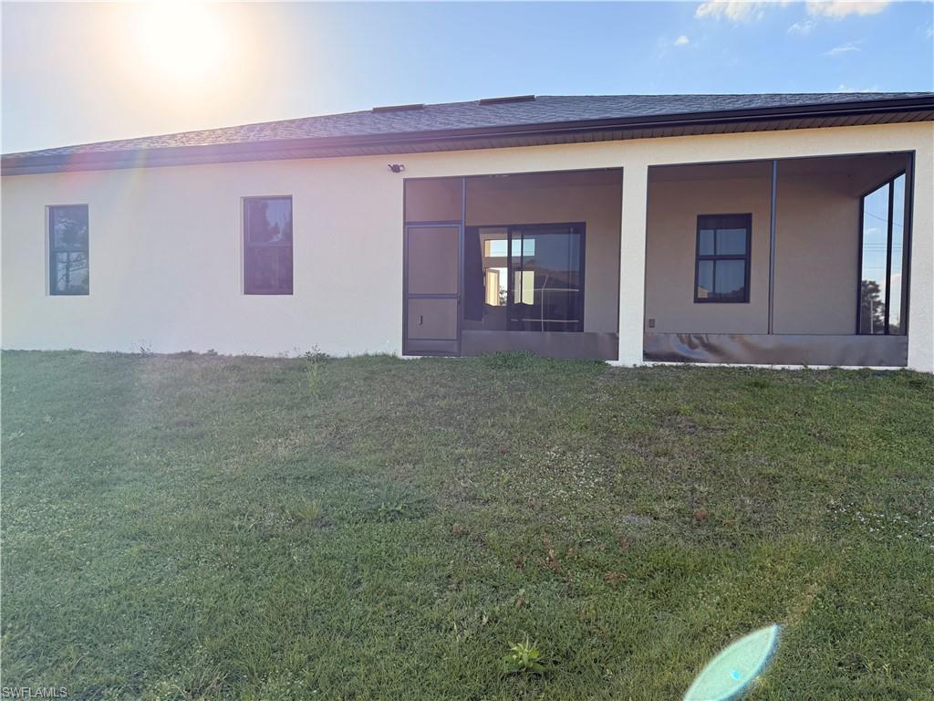 941 Columbus Boulevard Lehigh Acres, FL 33974 - Photo 23 of 41 a view of front door of a house