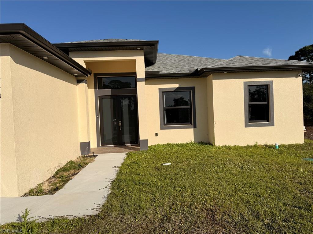 941 Columbus Boulevard Lehigh Acres, FL 33974 - Photo 33 of 41 a view of an entrance of the house