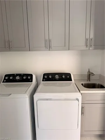 a view of a kitchen with refrigerator and a stove