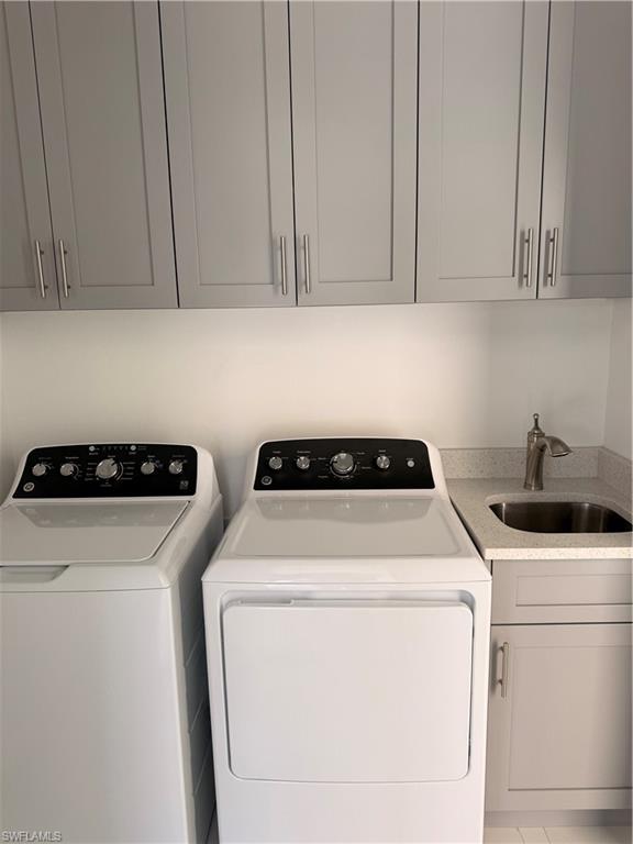 941 Columbus Boulevard Lehigh Acres, FL 33974 - Photo 36 of 41 a utility room with dryer and washer