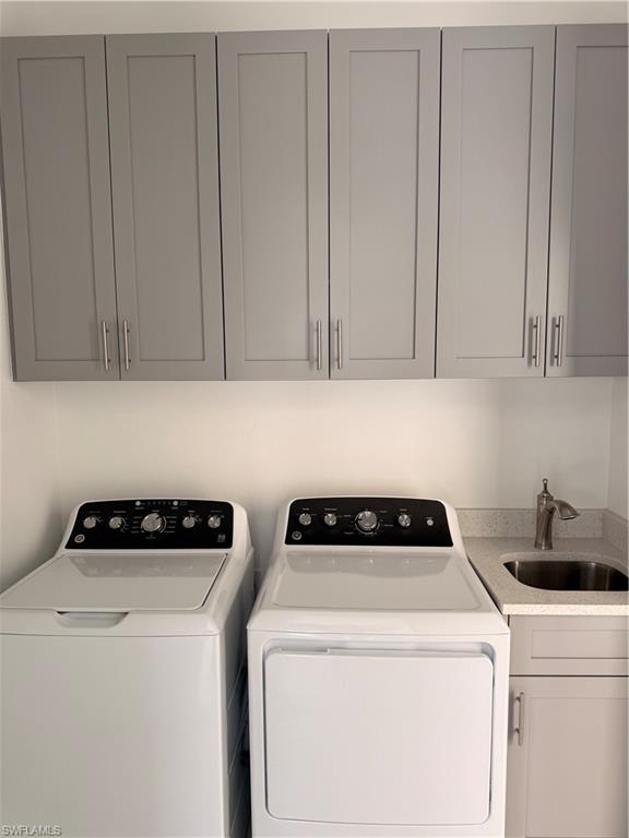 941 Columbus Boulevard Lehigh Acres, FL 33974 - Photo 37 of 41 a utility room with dryer and washer